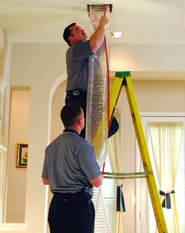 Vacuuming out an residential home air duct vent